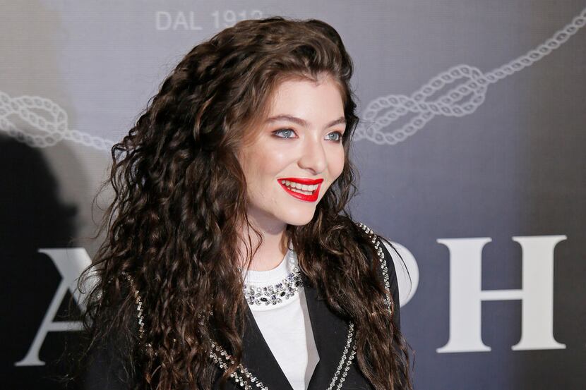 FILE - In this Nov. 18, 2014, file photo, singer Lorde poses for photographers during an...