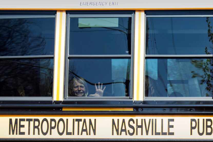 A child weeps while on the bus leaving The Covenant School following a mass shooting at the...