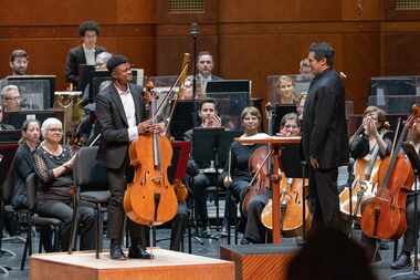 Cellist Sterling Elliott acknowledged applause after performing with the Fort Worth Symphony...