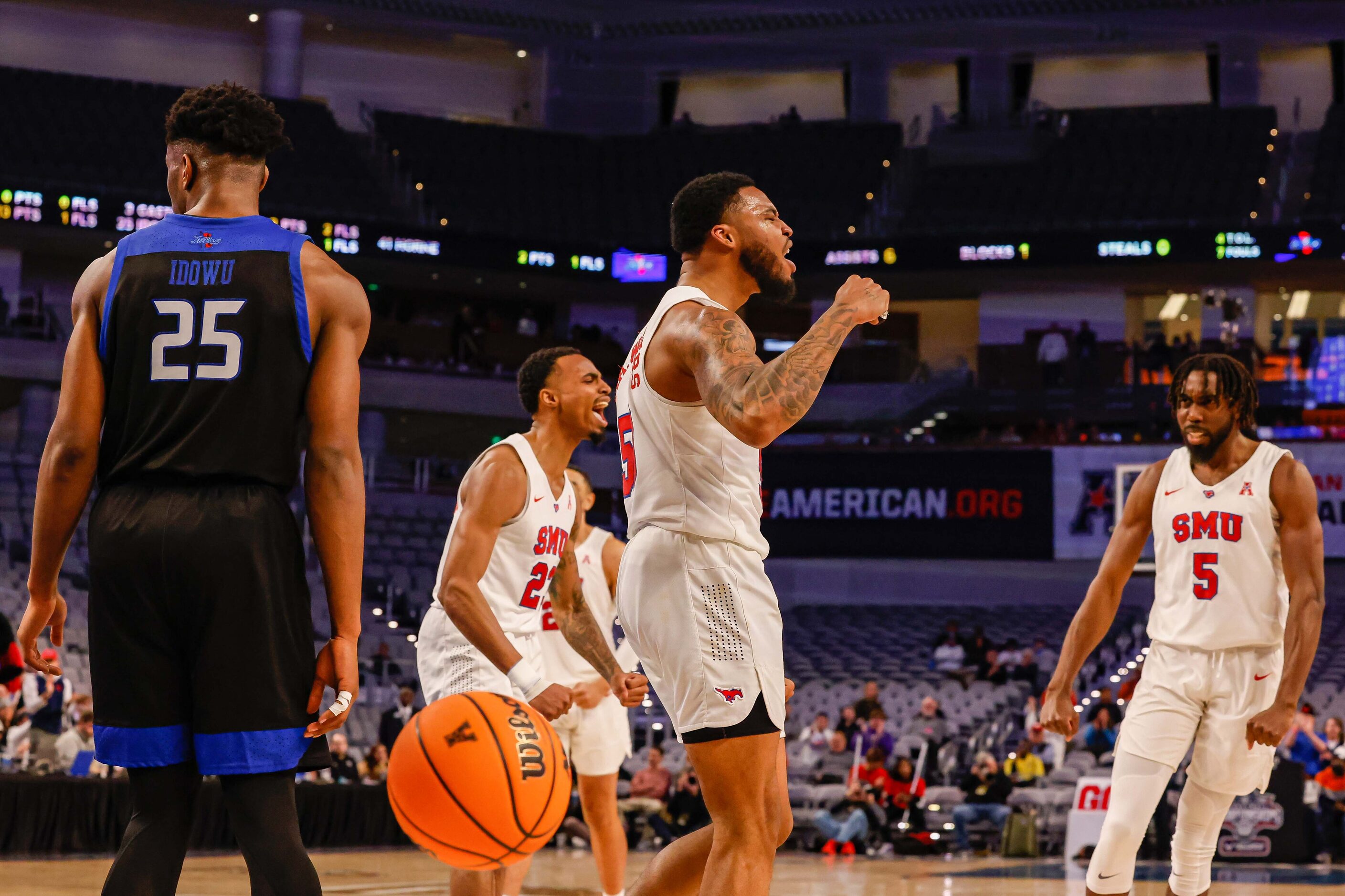 Southern Methodist Mustangs forward Marcus Weathers (50) celebrates a foul with guard...