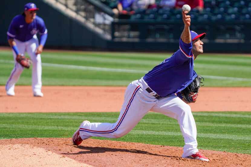 Texas Rangers pitcher Matt Bush delivers during the fourth inning of a spring training game...