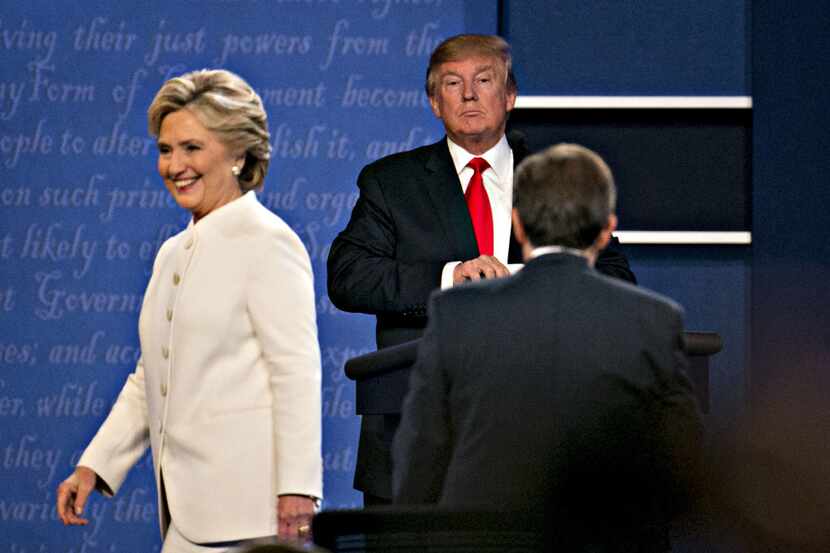Donald Trump and Hillary Clinton exit the stage after the final presidential debate. (Danel...