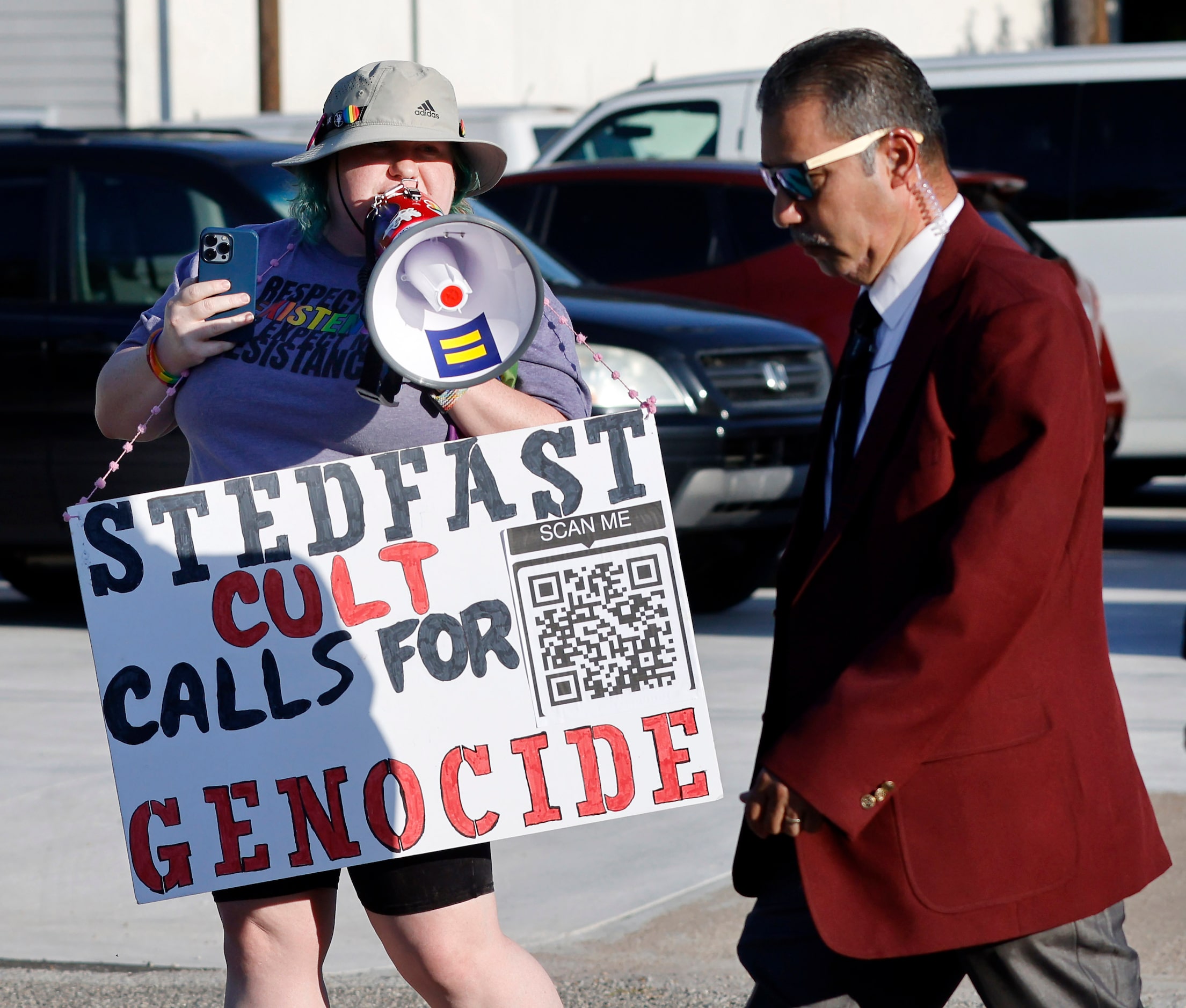 Protestor ‘Rain’ Knight of No Hate In Texas uses a bullhorn to yell at Stedfast Baptist...