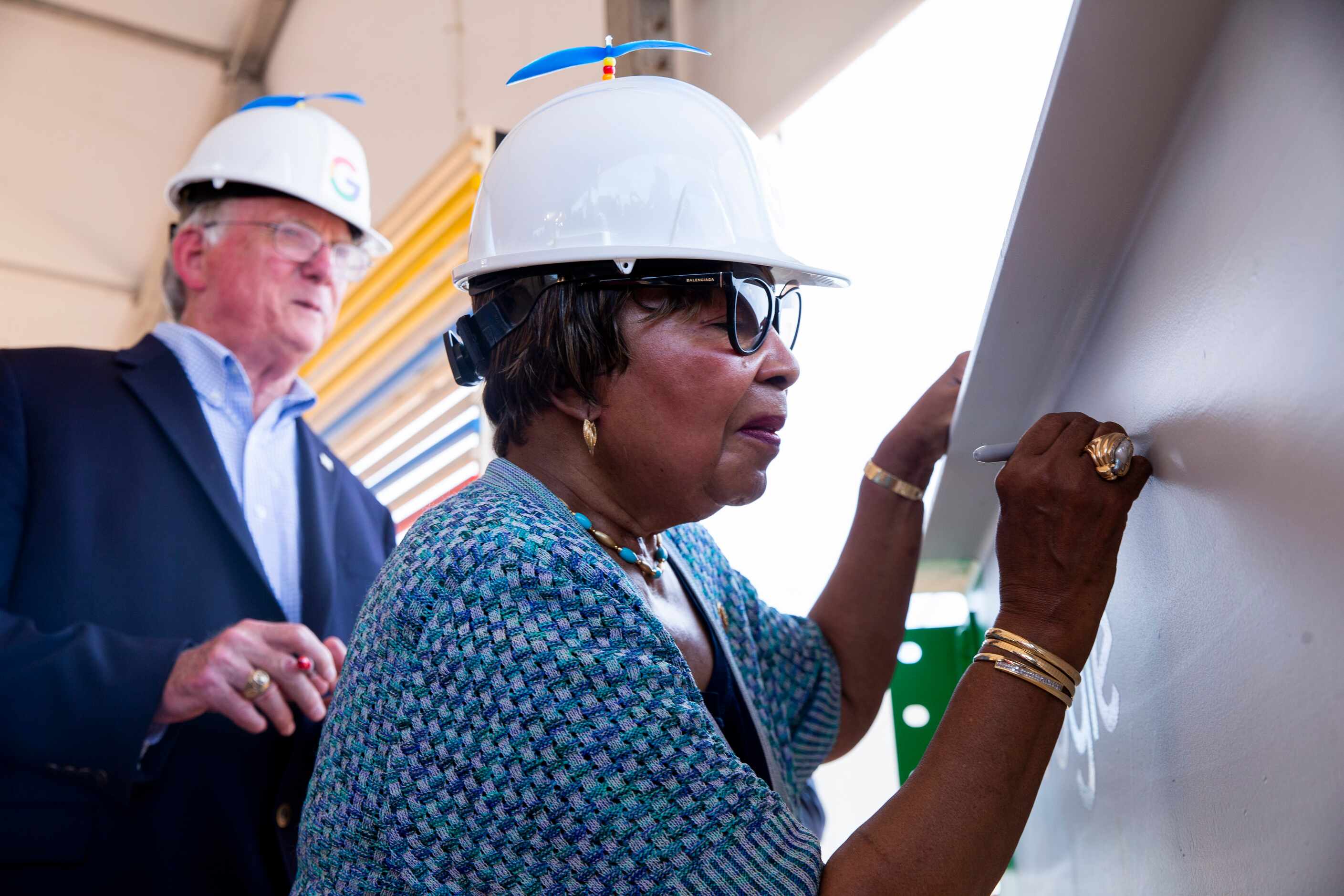 U.S. Rep. Eddie Bernice Johnson, D-Dallas, signs a steel beam during an announcement of...
