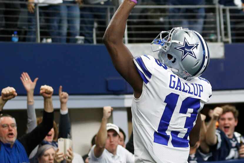 Dallas Cowboys wide receiver Michael Gallup (13) celebrates with fans after scoring a...