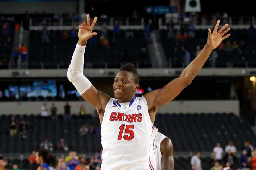 Will Yeguete (15) of the University of Florida Gators celebrates after beating the Florida...