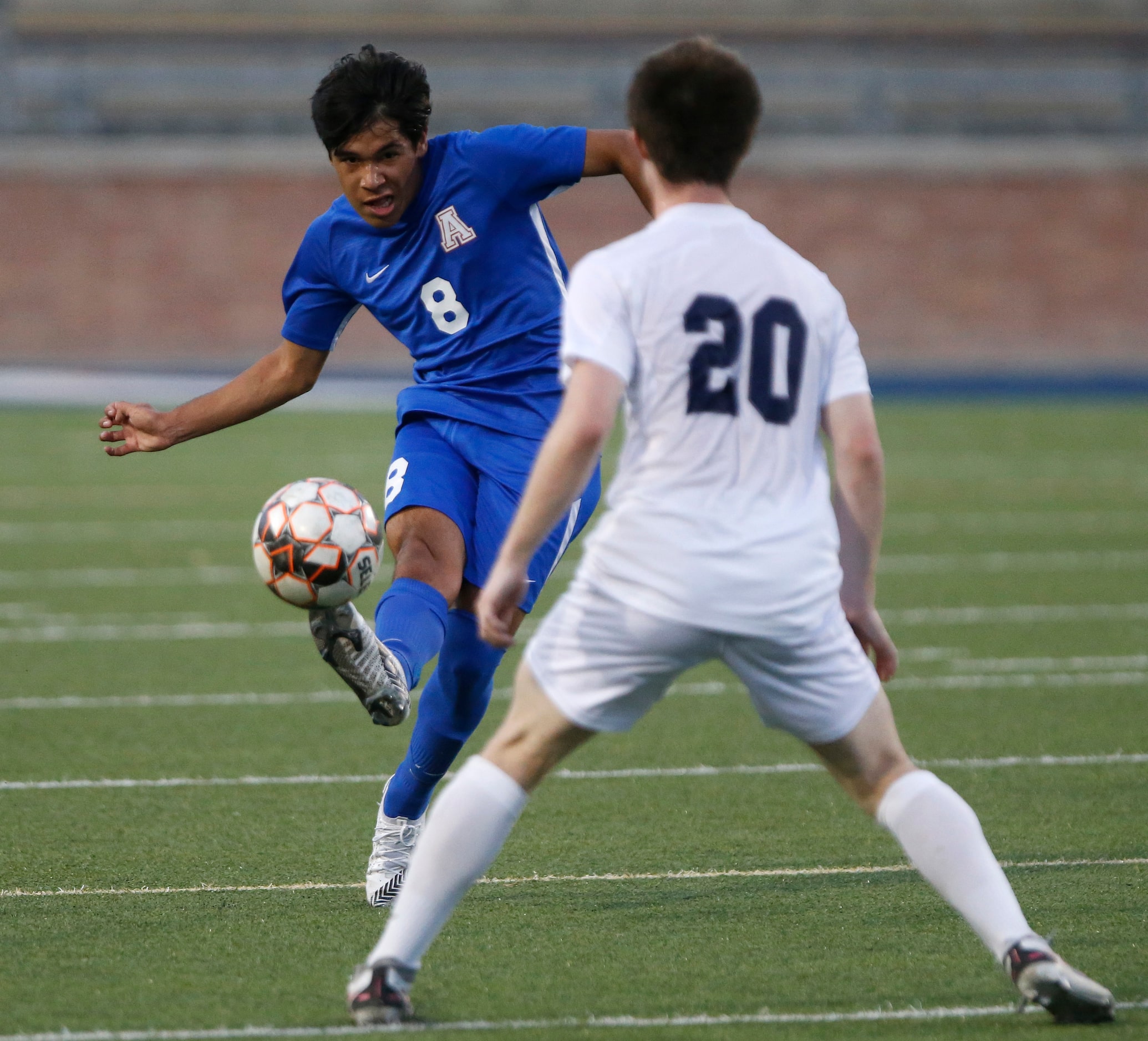 Allen midfielder Isaiah Moreno (8) makes a pass past Keller defender Britton Majure (20)...