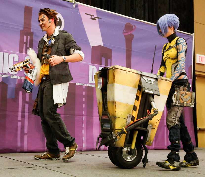 Ryan Gartman as Handsome Jack and Rachel Young as Maya from the video game Borderlands 2,...