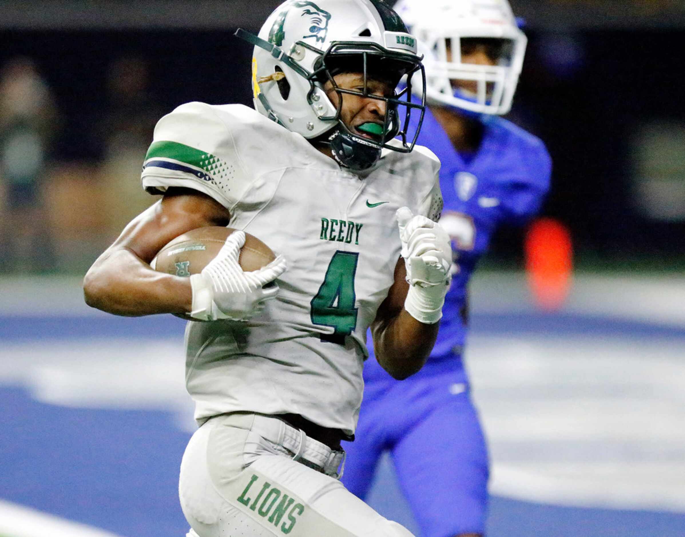 Reedy High School running back Jacob Smith (4) scores a touchdown during the second half as...