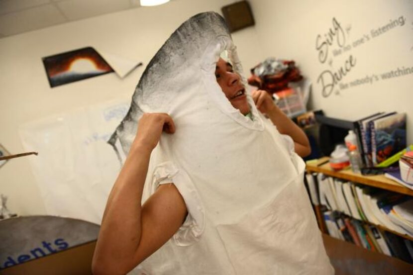 
Student Julian Carrillo tries on a cigarette costume for his Destination Imagination team's...