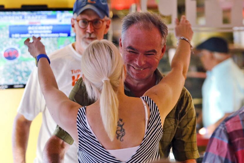 Democratic vice presidential candidate Sen. Tim Kaine, D-Va., greets Susie Joines at City...