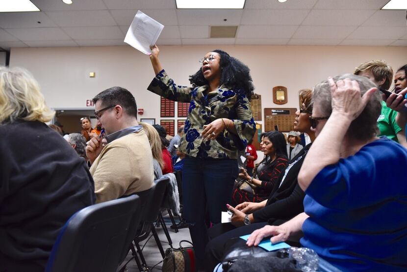 Judge Amber Givens-Davis of the 282nd Judicial District Court stands to ask a question about...