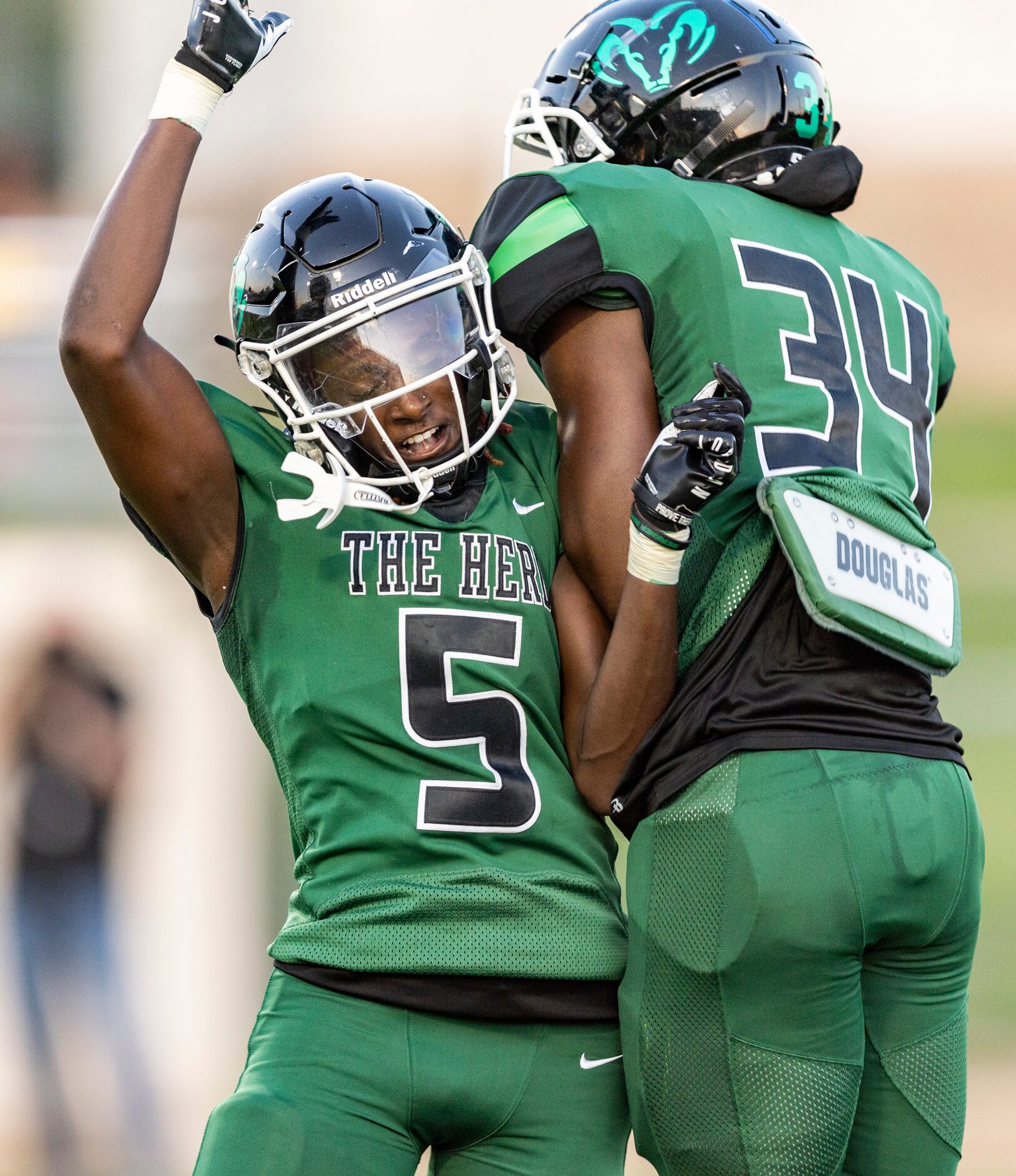 Berkner sophomore offensive lineman Dante Doyle (34) is congratulated by senior wide...