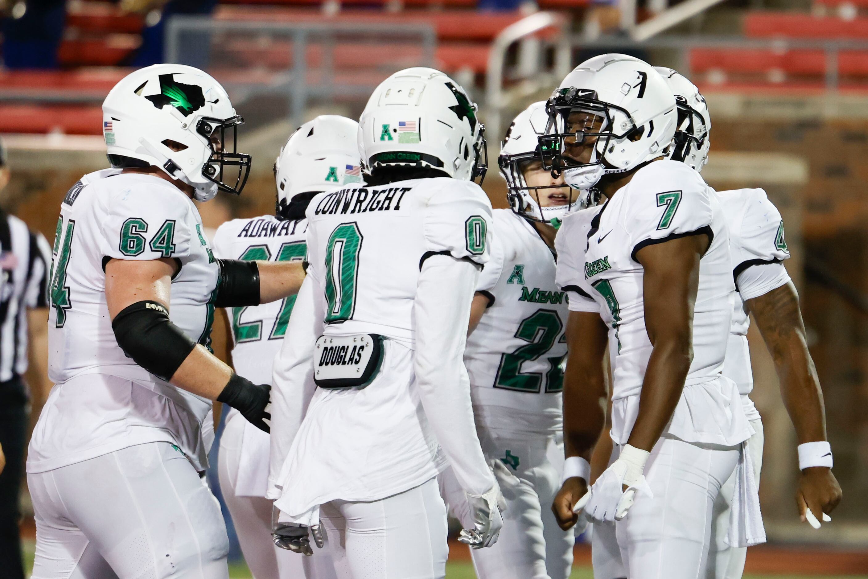 North Texas Mean Green wide receiver Trey Cleveland (7) cheers with his teammates after...