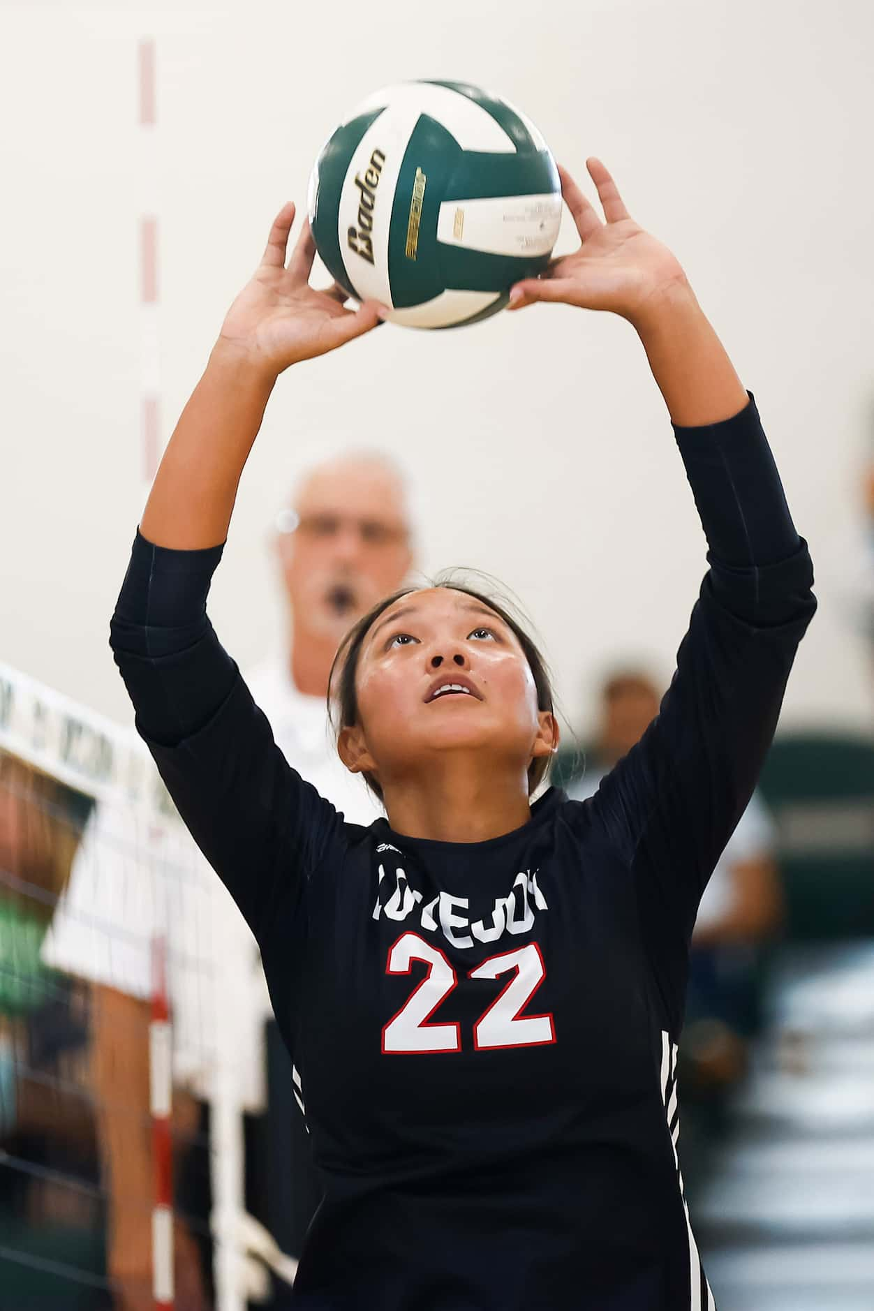 Love Joy senior setter Bethanie Wu sets the ball during a high school volleyball match...