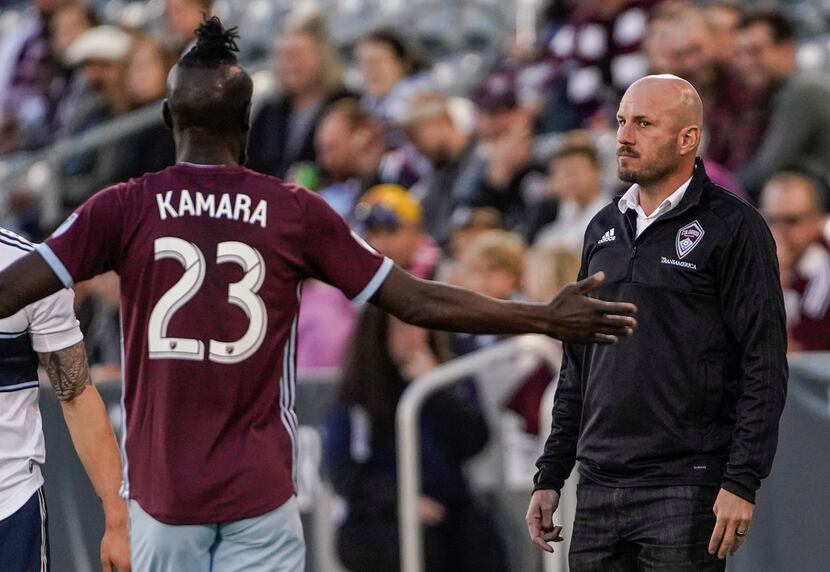 The Colorado Rapids' new coach, Conor Casey, eyes Kei Kamara (23) during the first half of...