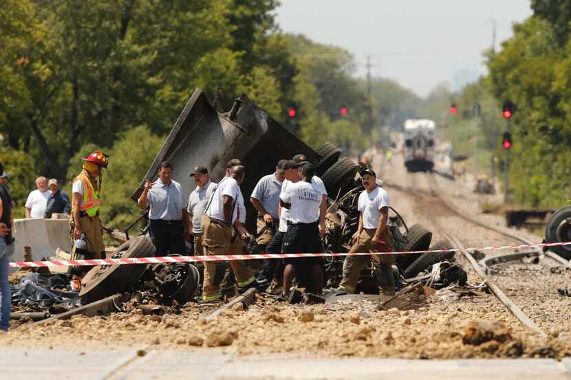 Two people were killed in a dump truck that collided with a Trinity Railway Express...