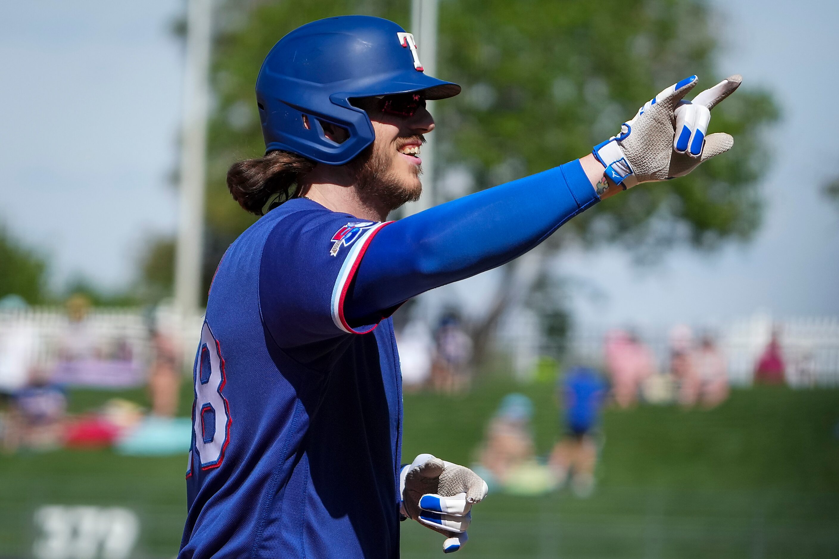 Texas Rangers catcher Jonah Heim celebrates as he rounds the bases after hitting a home run...