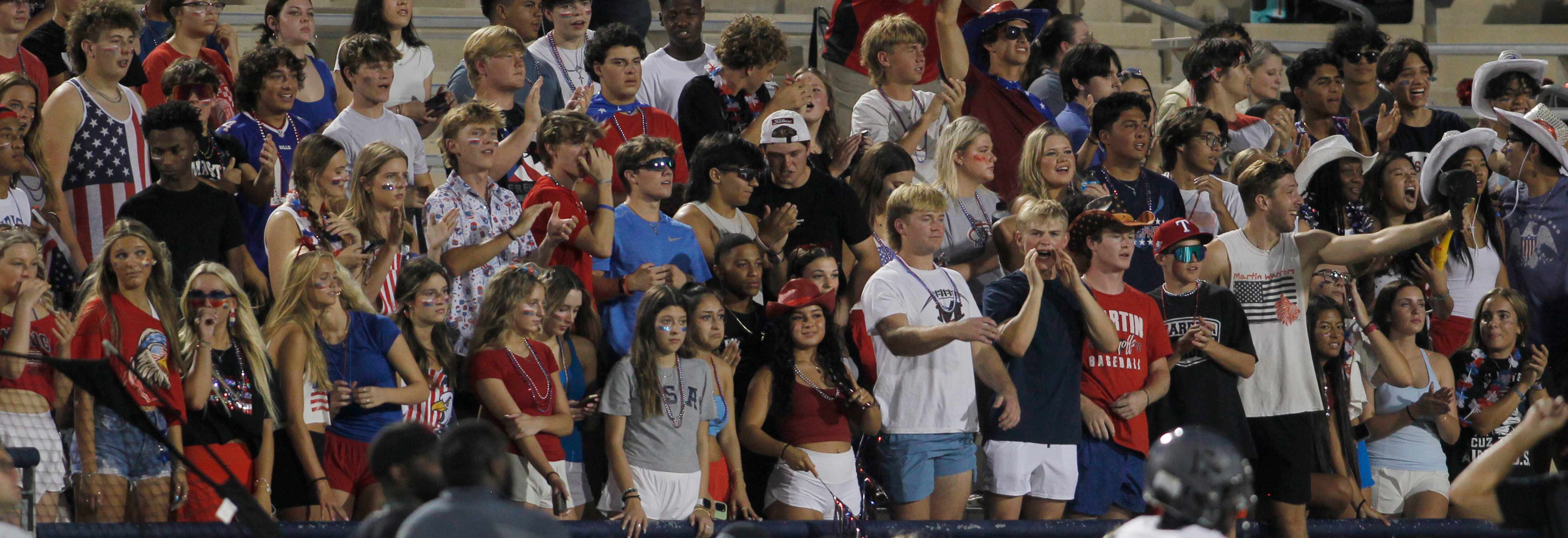 Fans filling the Arlington Martin student section look on during first quarter action of the...