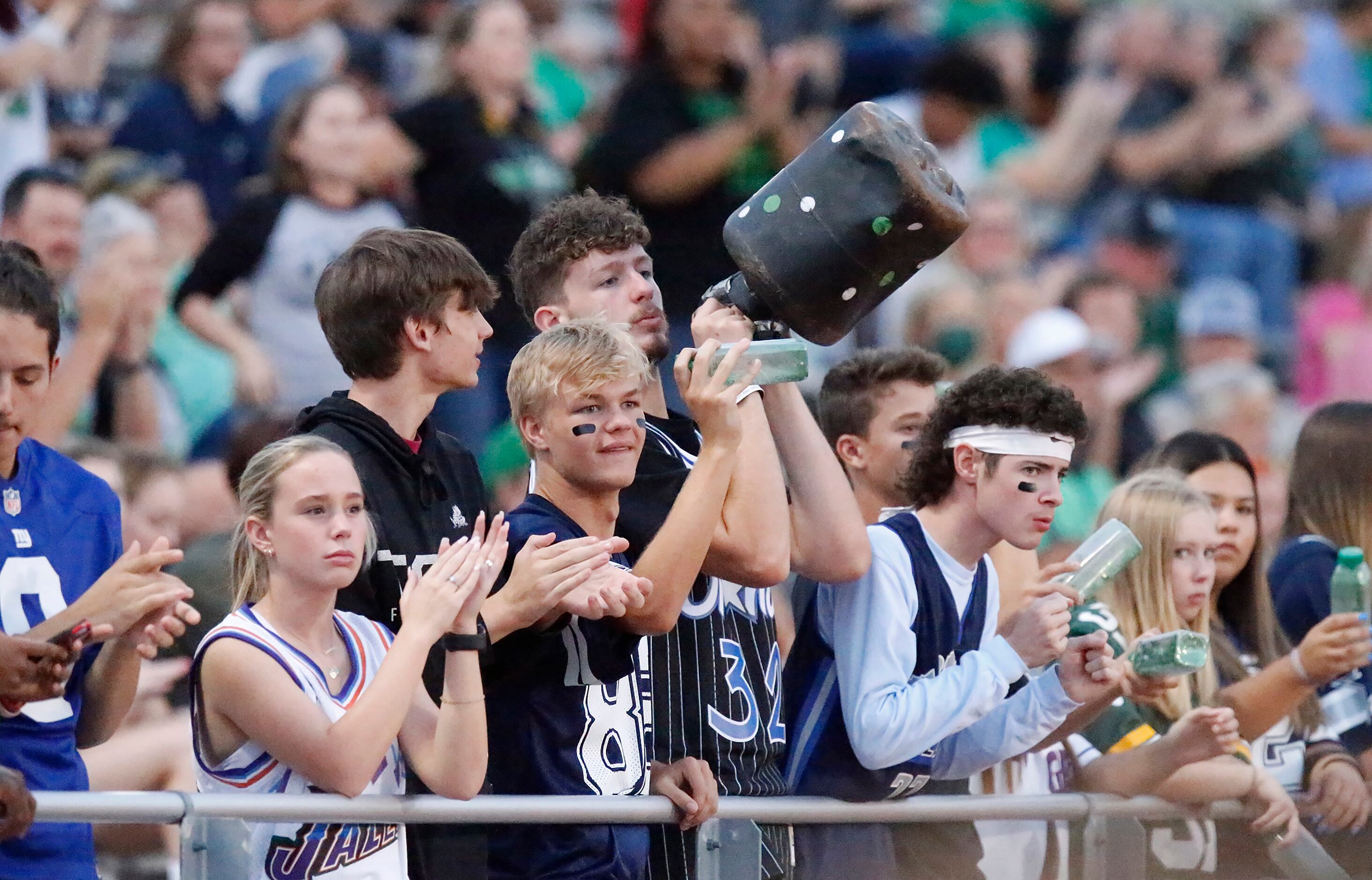 Lake Dallas students celebrate a touchdown during the first half as Frisco High School...