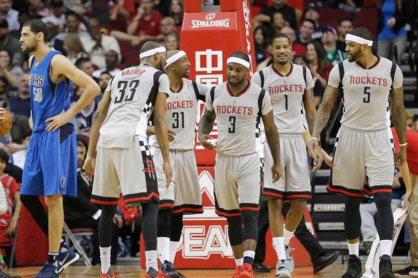 Houston Rockets guard Ty Lawson (3) celebrates his basket with teammates against the Dallas...