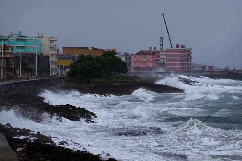 Waves crash against a seawall in Baracoa, Cuba, Tuesday, Oct. 4, 2016, before the arrival of...