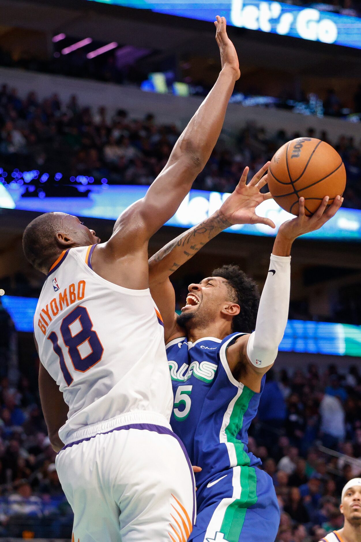 Dallas Mavericks center Christian Wood (35) collides with Phoenix Suns center Bismack...