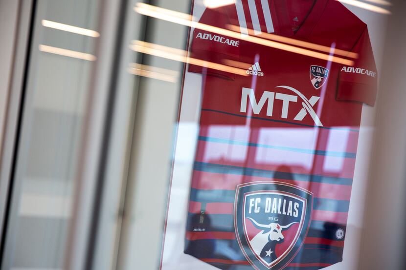 An FC Dallas jersey with the MTX name on it is framed in Nobel's Frisco office. MTX is a...