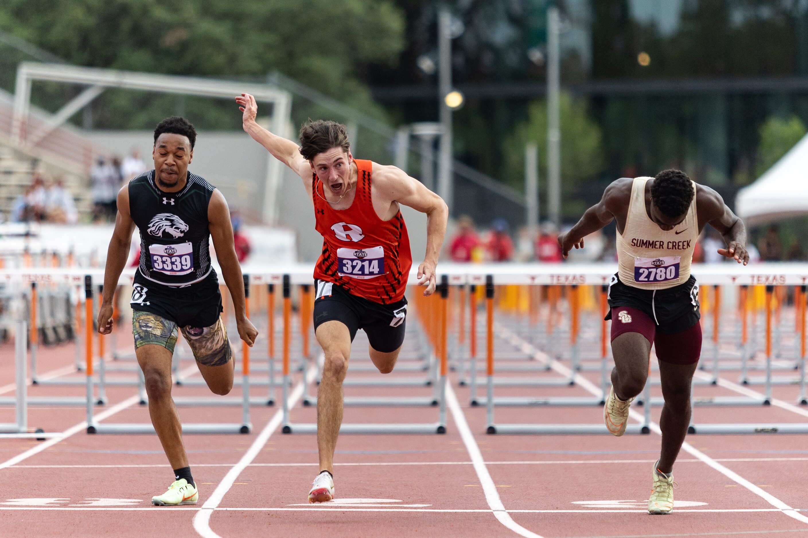 Samuel Alves of Rockwall, center, races toward the finish in the boys’ 110-meter hurdles at...