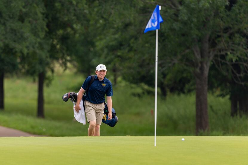 Highland Park's Turner Hosch walks to the 5th green during round 1 of the UIL Class 5A boys...