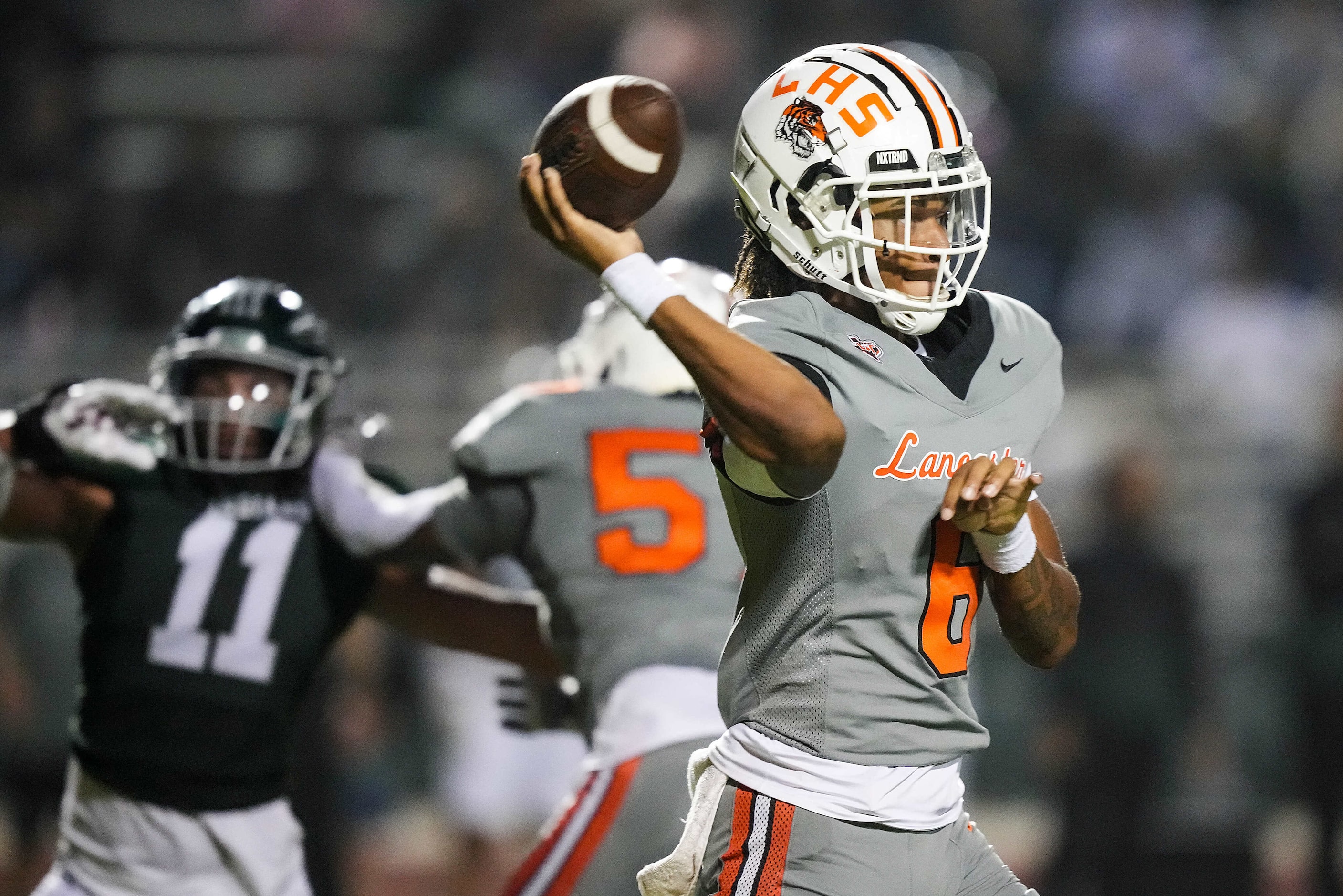 Lancaster quarterback Carter Jones (6) throws a pass during the first half of a District...