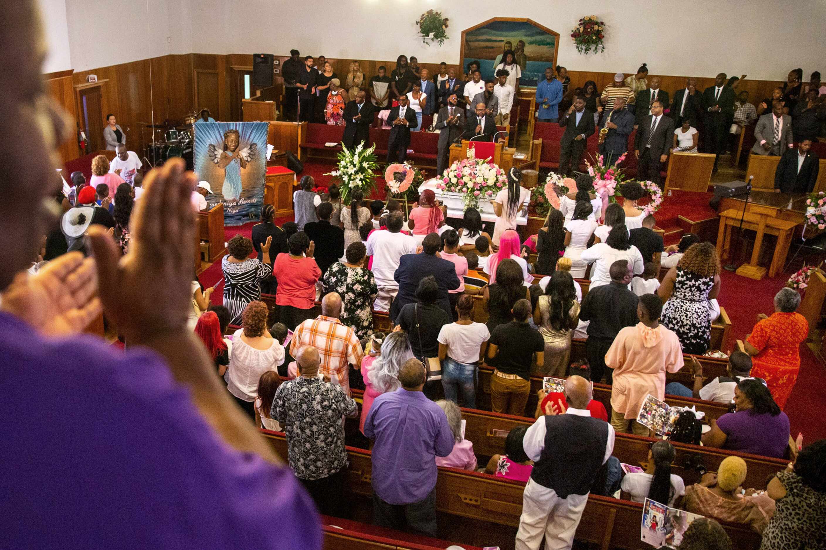 Mourners fill the pews at New Morning Star Missionary Baptist Church for BrandoniyaÕs funeral.