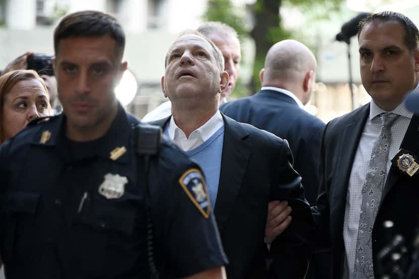 Harvey Weinstein arrives for arraignment at Manhattan Criminal Courthouse in handcuffs after...
