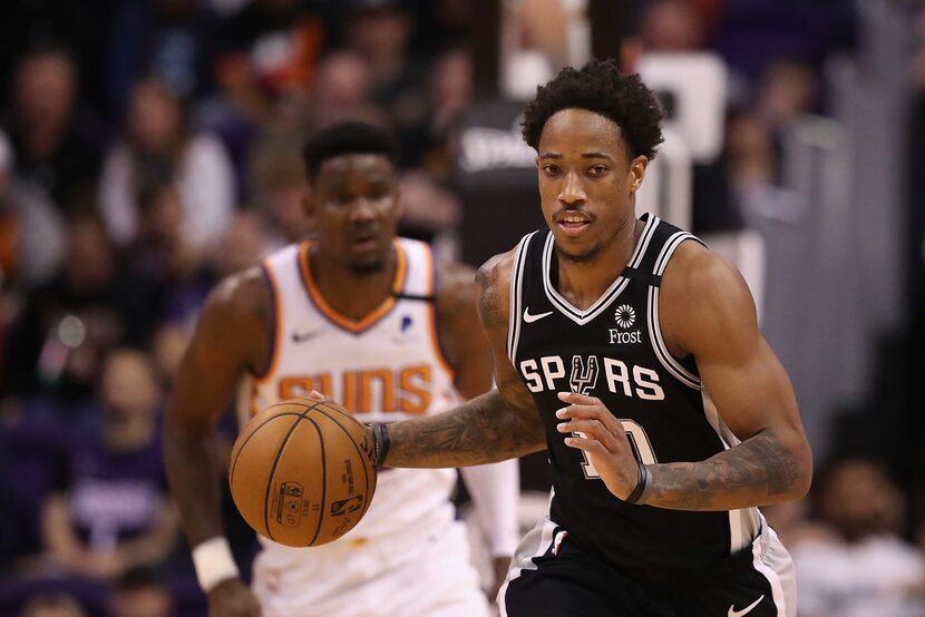 PHOENIX, ARIZONA - JANUARY 20: DeMar DeRozan #10 of the San Antonio Spurs handles the ball...