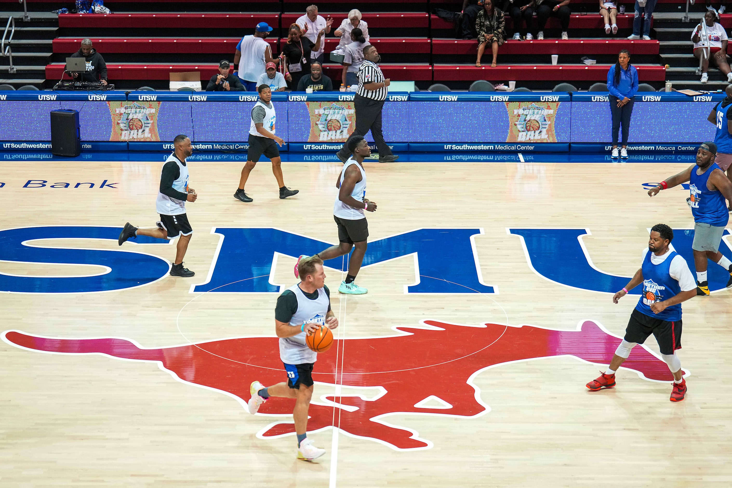 Matthew Ruffner, pastor of Preston Hollow Presbyterian Church, brings the ball up the court...