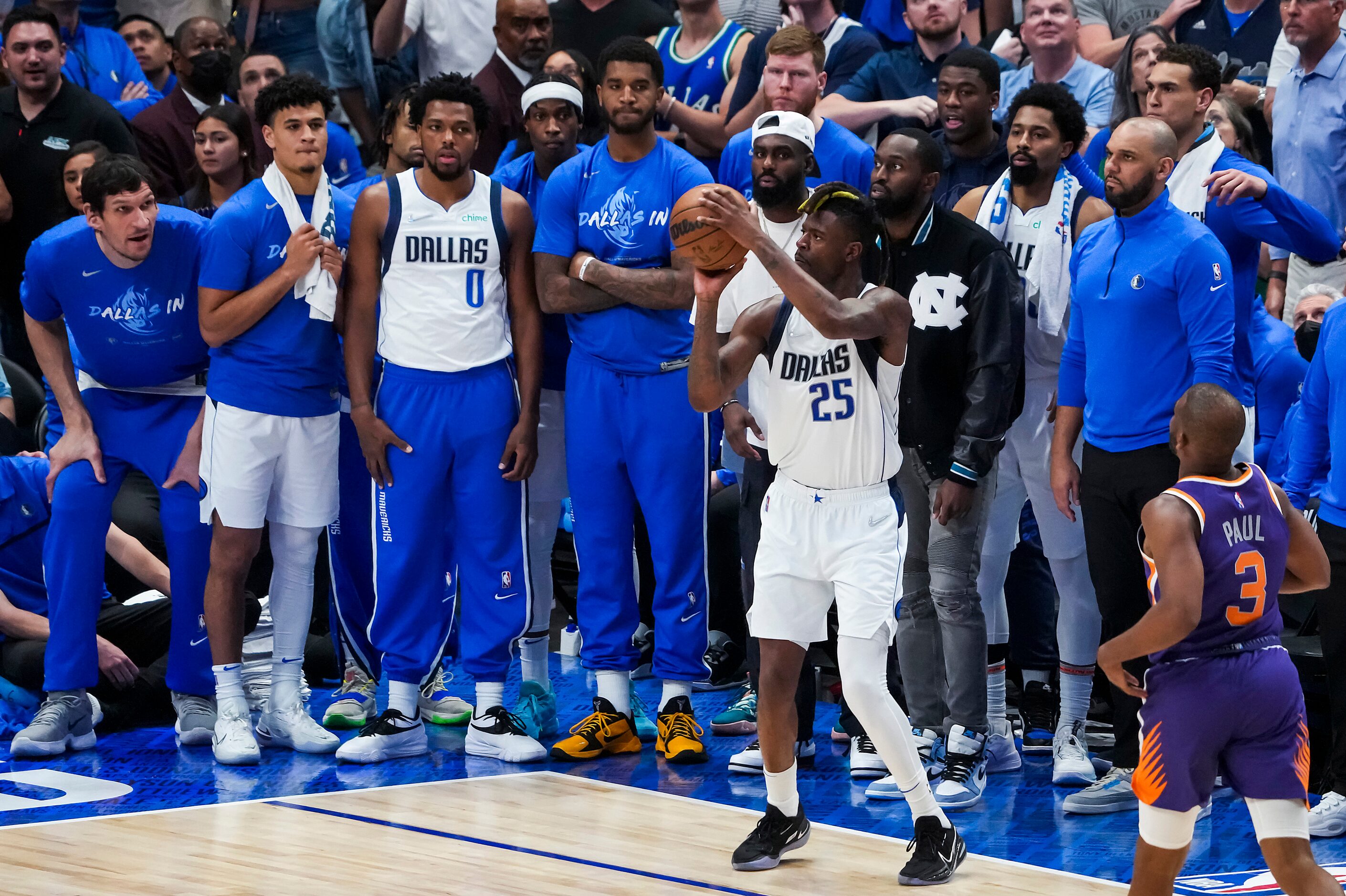 Dallas Mavericks forward Reggie Bullock (25) hits a 3-pointer with under a minute left to...