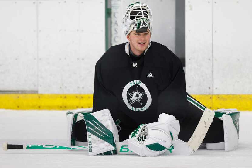 Dallas Stars goaltender Jake Oettinger stretches during a training camp practice at the...