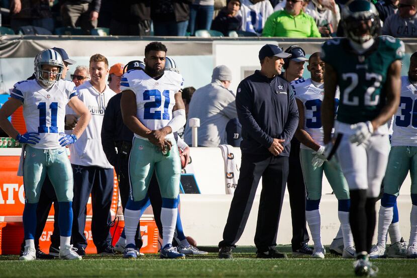 Dallas Cowboys running back Ezekiel Elliott (21) watches from the sidelines during the first...