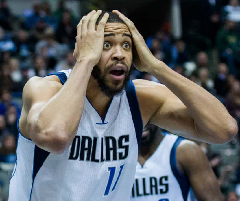 Dallas Mavericks center JaVale McGee (11) reacts to a foul called on him during double...