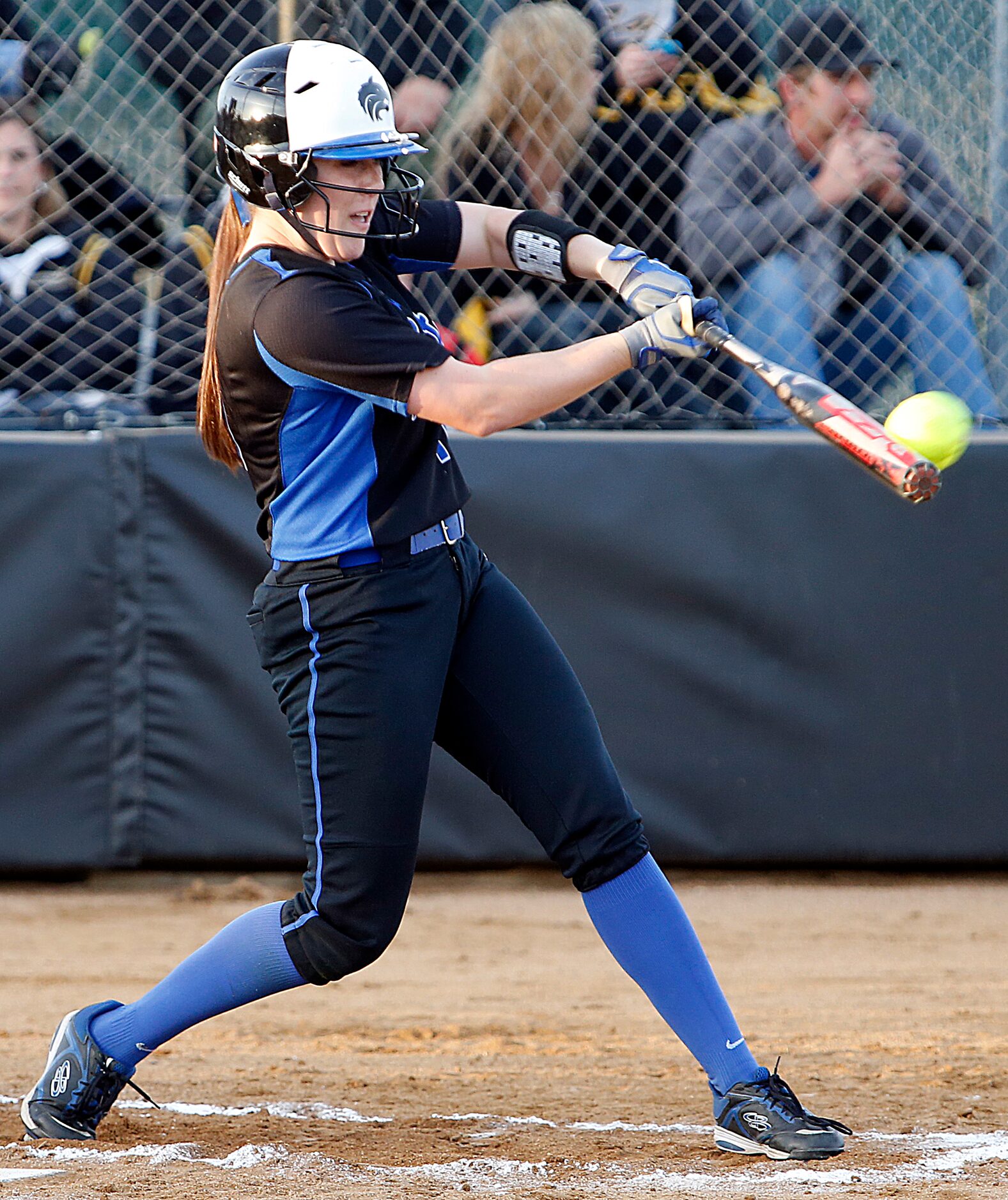 Plano West High School outfielder Amelia Trotter (11) hits a solo home run to give her team...