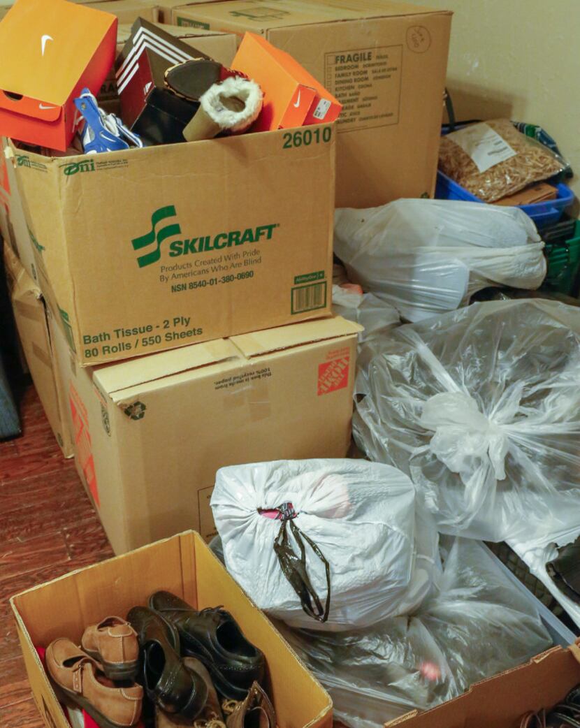 The donated shoes at the Lasater home have  filled the garage and spilled over into the...