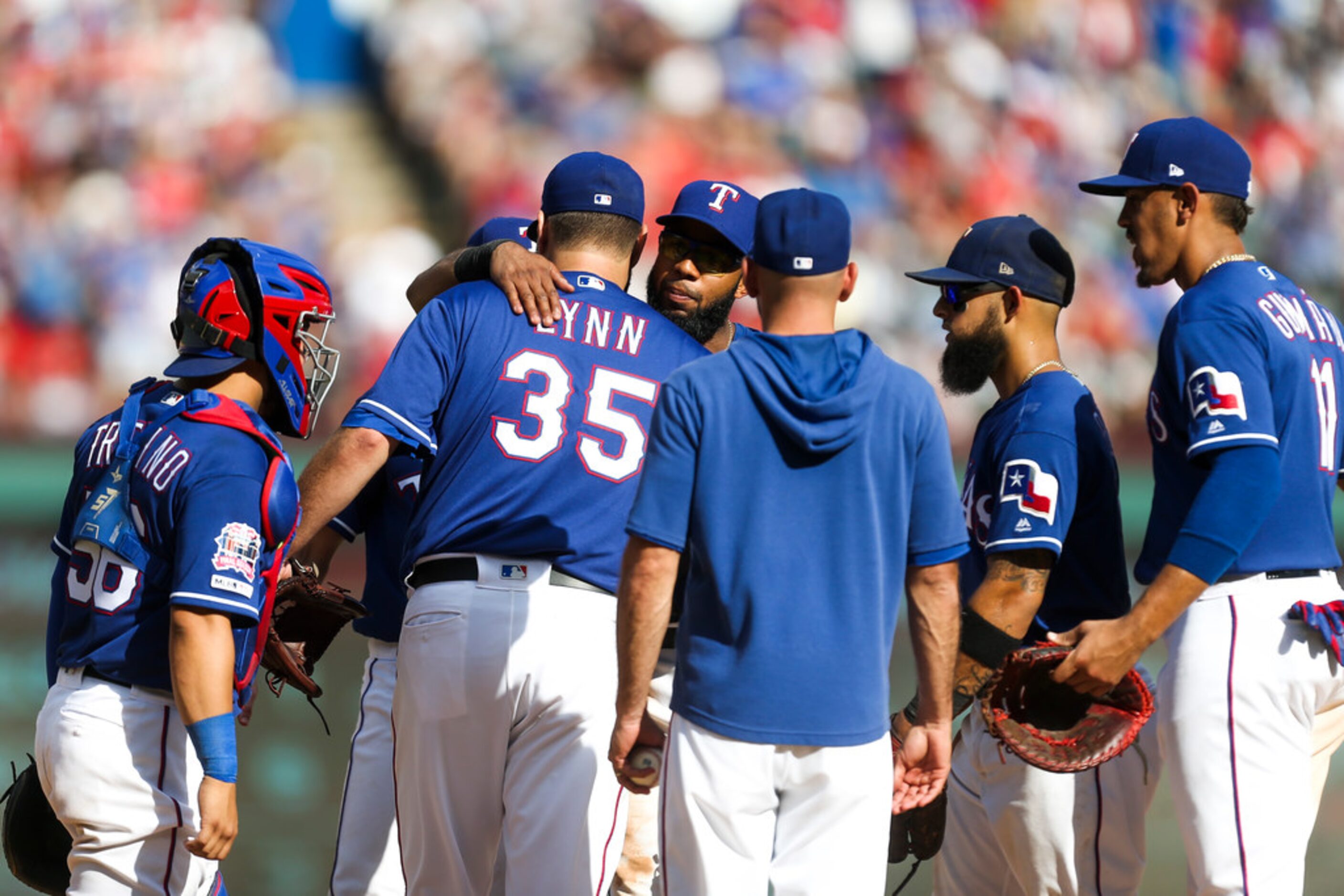 Texas Rangers starting pitcher Lance Lynn (35) is congratulated by his teammates after...