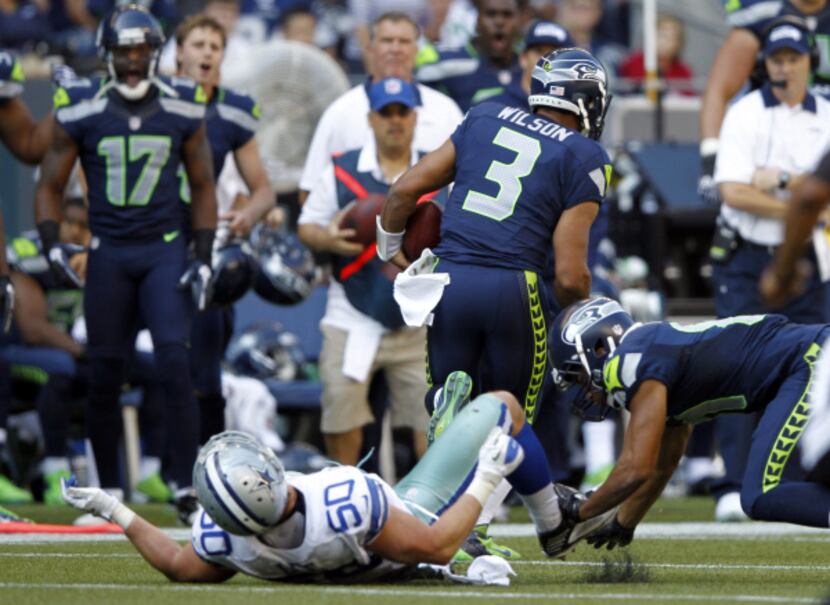Seattle Seahawks quarterback Russell Wilson (3) breaks away after Seattle Seahawks wide...