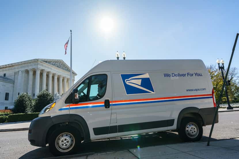A U.S. Postal Service truck makes deliveries next to the Supreme Court on Election Day, Nov....