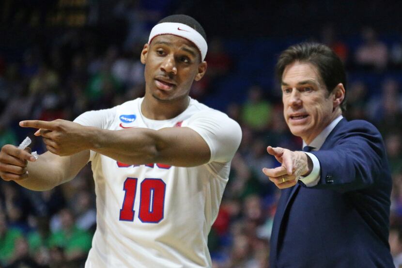 SMU guard Jarrey Foster (10)confers with coach Tim Jankovich in the second half during the...