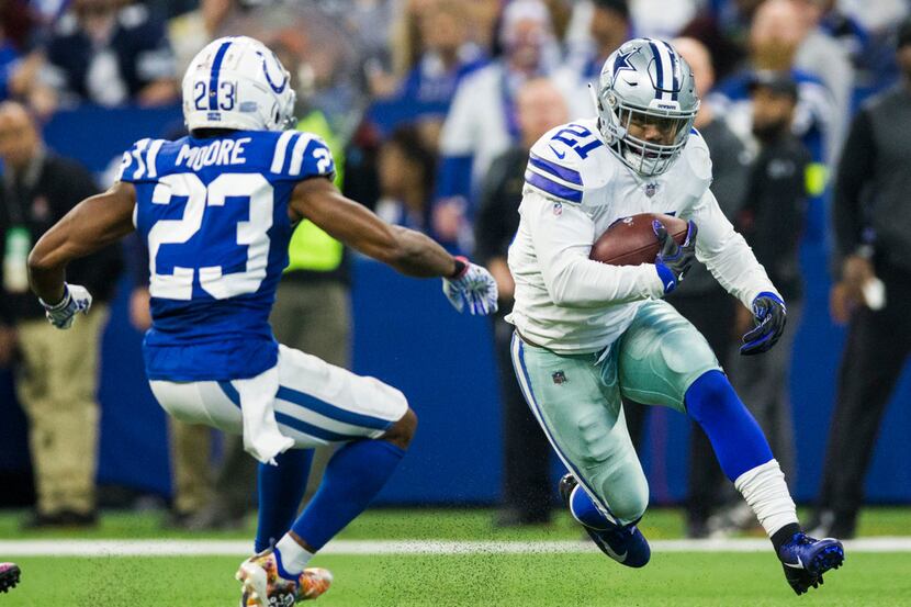 Dallas Cowboys running back Ezekiel Elliott (21) runs the ball with Indianapolis Colts...