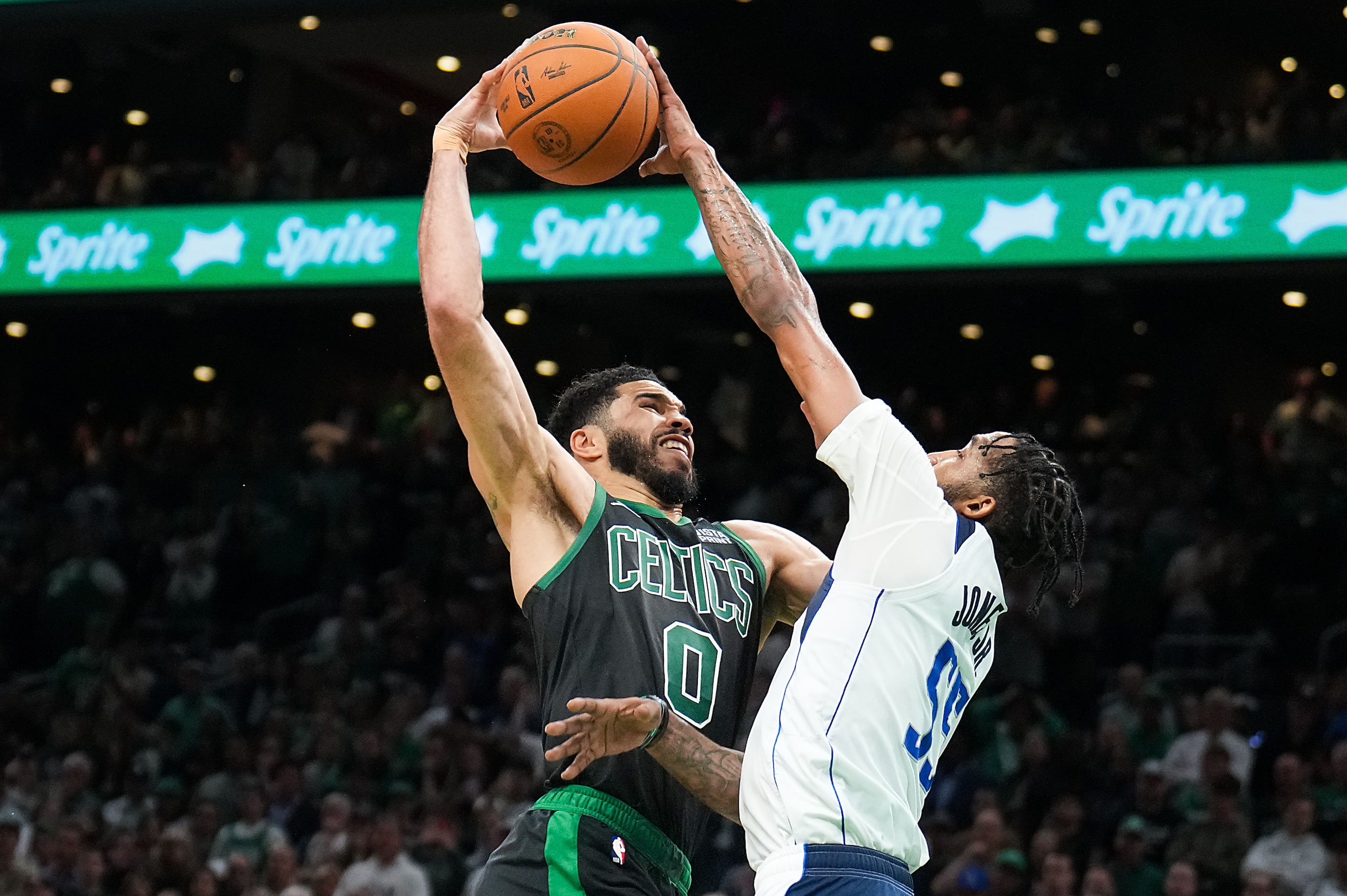 Dallas Mavericks forward Derrick Jones Jr. (55) blocks a shot by Boston Celtics forward...