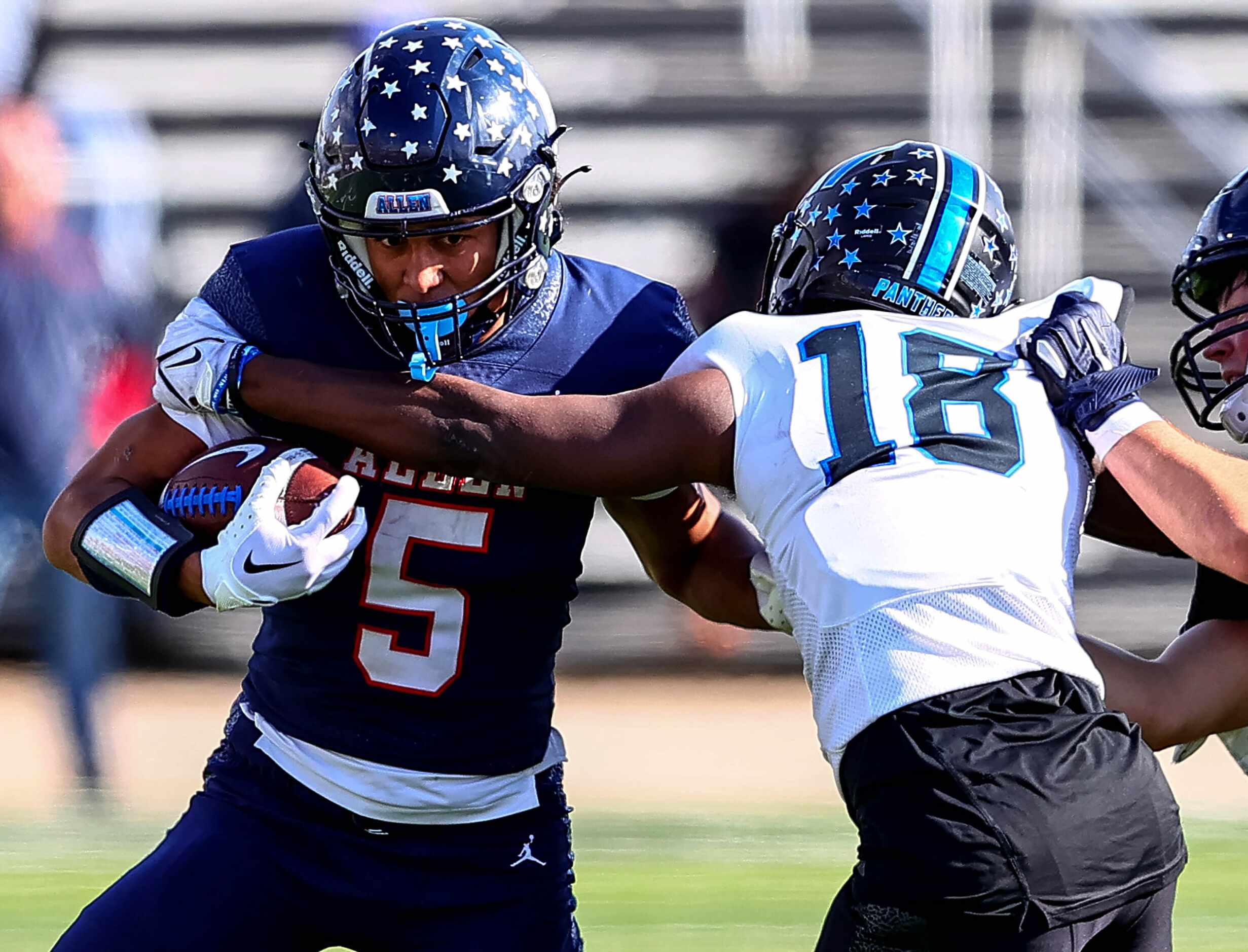 Allen wide receiver Quinton House-Hammonds (5) gets wrapped up by North Crowley linebacker...