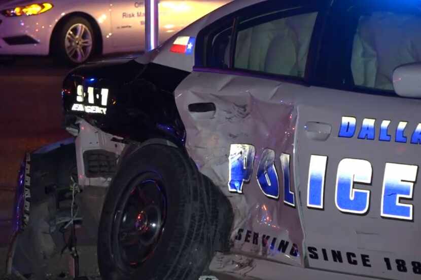 A Dallas police squad car was heavily damaged when it was hit by a possibly drunken driver...