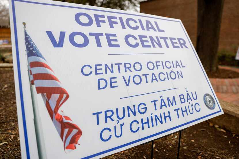 A sign notifies people of a polling location in Dallas. Voting for several suburban runoff...